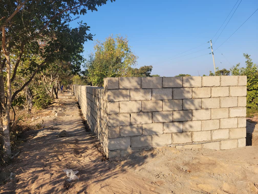 Security Fence Underway with Locally-Made Cement Blocks